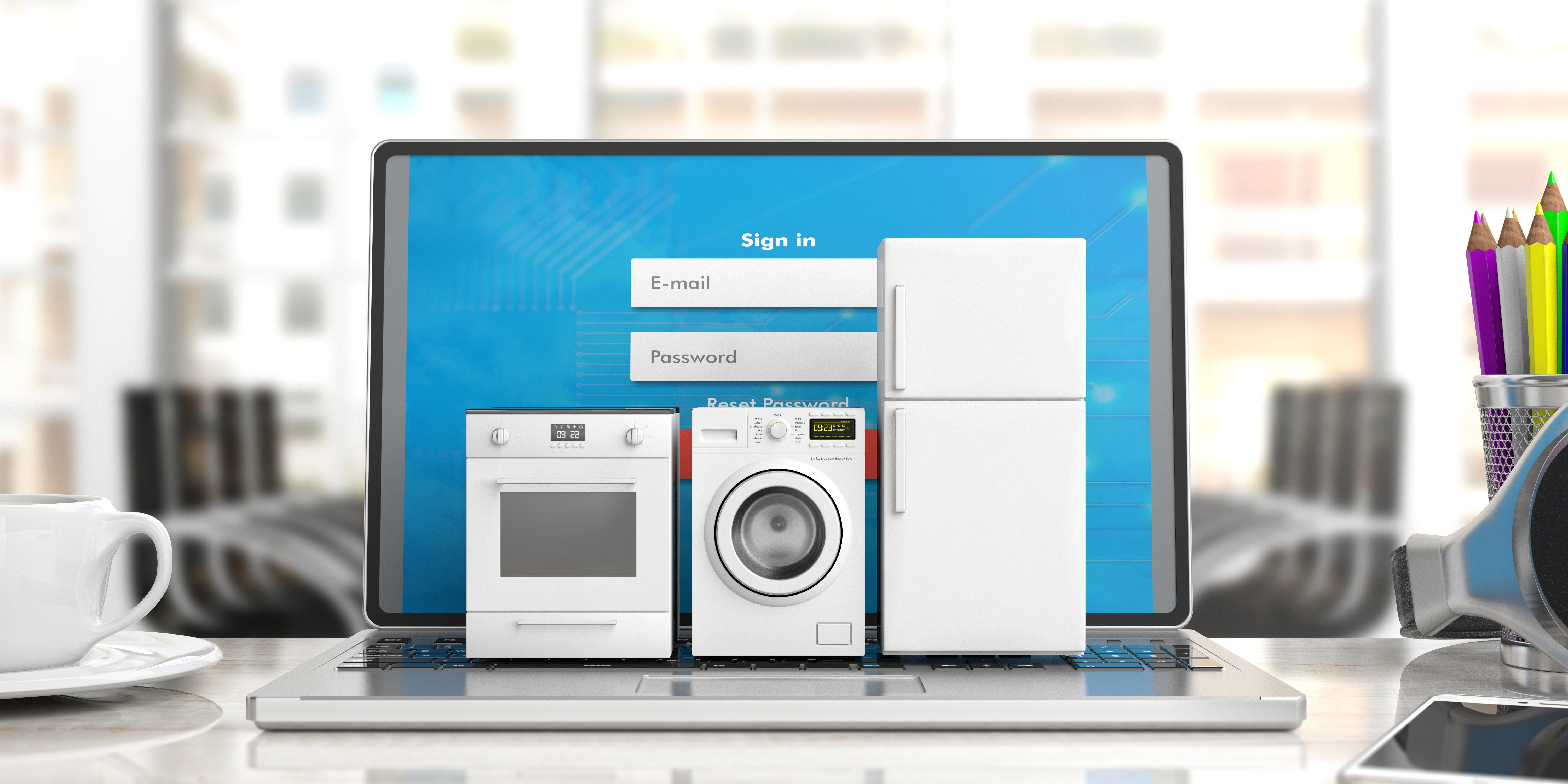 Laptop auf dem mehrere miniatur Haushaltsgeräte stehen. Ein Herd, eine Waschmaschiene und eine Kühl-Gefrier-Kombi sind zu sehen.